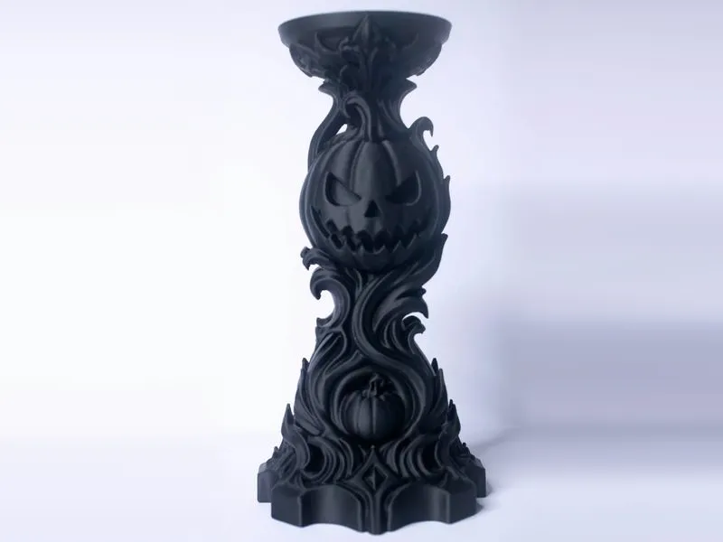 Black 3D-printed Samhain candle holder with a carved jack-o'-lantern and swirling gothic ornament